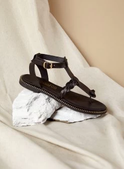 KOUFONISSIA SANDALES PLATES EN CUIR NOIR